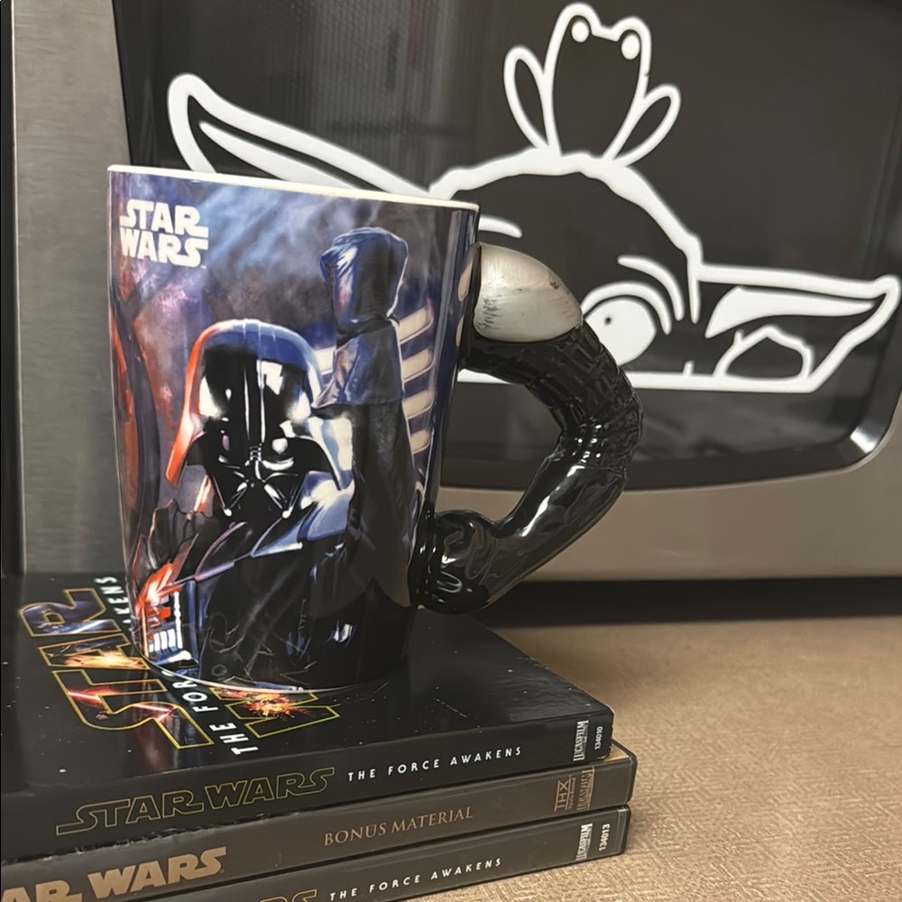 NWOT Never used Star Wars Darth Vader mug. Handle is Vader’s arm and fist.
